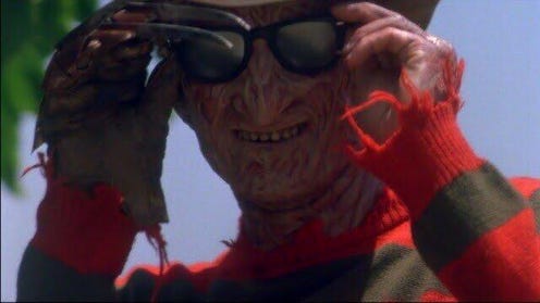 Still image featuring Freddy Krueger putting on sunglasses