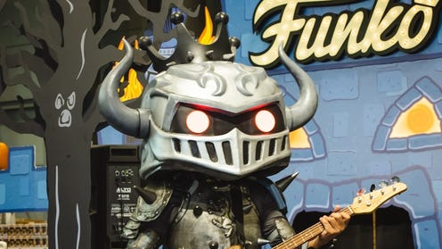 Cropped photo of a Funko playing a guitar