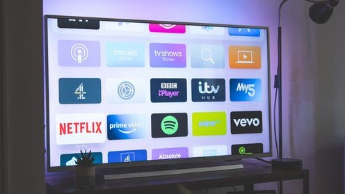 Photograph of a television featuring different streaming apps