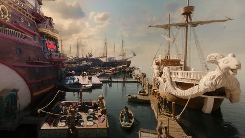Still image from One Piece trailer featuring ships in harbor