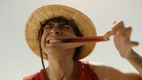 live-action Luffy stretching his mouth wide