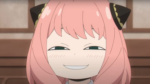 Anya pulling her 'heh' face, which is a mischievous slight smile, in the popular anime series Spy x Family.